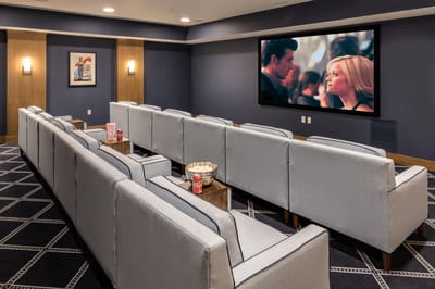 Cozy theater room with seating for movie viewing