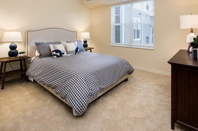 Cozy resident bedroom with a bed and natural light