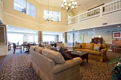 Bright interior common area with seating and dining space