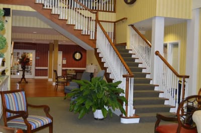 Interior view of a common area with stairs and seating