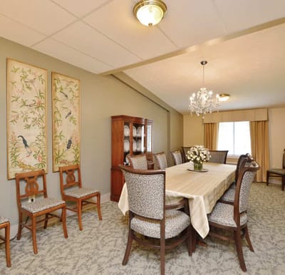 Dining room with elegant furnishings and a chandelier