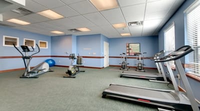 Well-equipped fitness room with exercise equipment