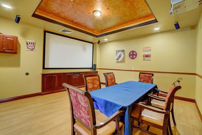 Interior room with a table and chairs set up for activities