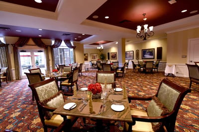 Dining area with elegantly set tables and decor