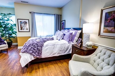 Cozy private room with bed and comfortable seating