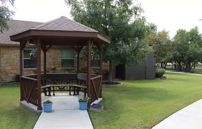 Outdoor gazebo in a landscaped area