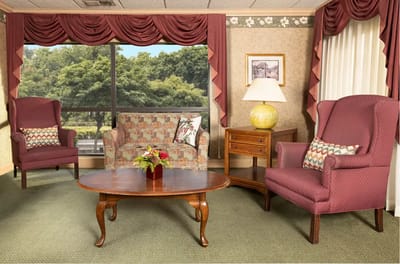 A cozy common area with seating and a decorative table