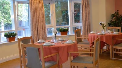 Dining area set up with tables and chairs