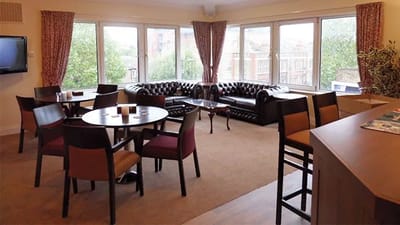 Common area with seating and large windows