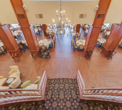 Interior dining area with tables and chandelier