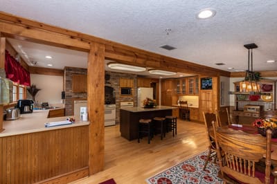 Brightly lit kitchen area with wooden accents