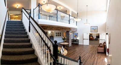 Interior view of a spacious common area with stairs