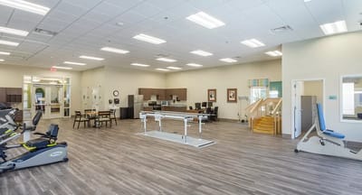 Interior view of a physical therapy room with equipment