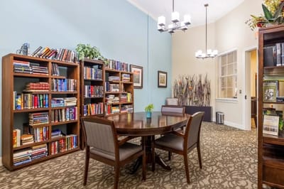 Cozy reading area with bookshelves and a table