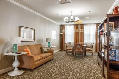 Cozy lounge area with seating and a dining table