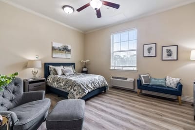 Cozy resident room with bed and seating area