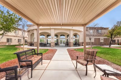 View of an outdoor seating area with facility architecture