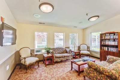 Common area with seating and bookshelves