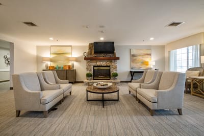 Common area with comfortable seating and a fireplace