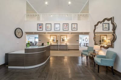 Interior view of a lobby with seating and framed pictures