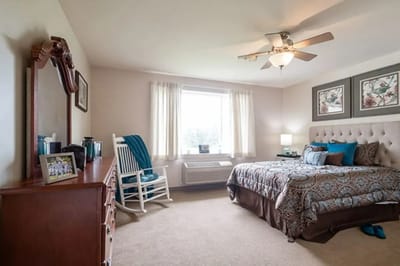 Cozy private resident room with bed and seating