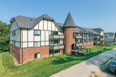 Exterior view of Tudor Heights facility with architecture