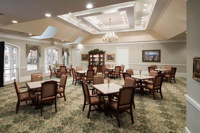 Interior view of a dining area with tables and chairs