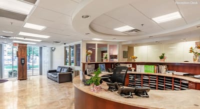Interior view of a reception area with seating and desk