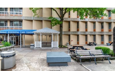 Outdoor courtyard with seating and gazebo
