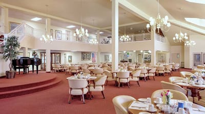 Interior dining room with tables and chandeliers