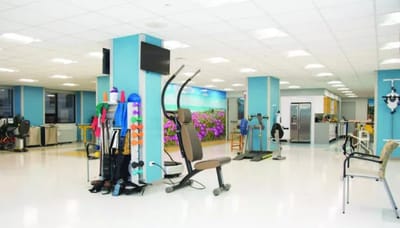 Interior view of a rehabilitation room with exercise equipment