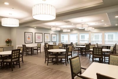 Bright dining area with tables and chairs