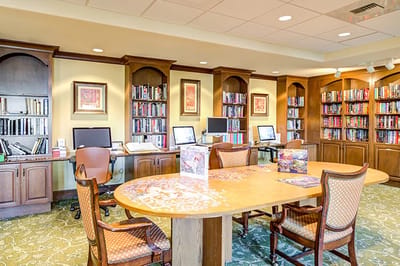 Cozy library space with books and computers.