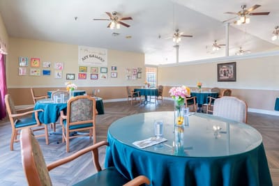 Interior dining area with tables and artwork