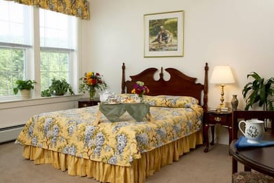 A cozy private room with floral decor and soft lighting