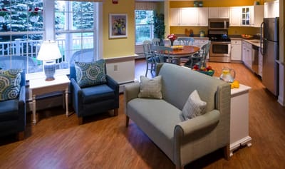 Bright common area with seating and dining space