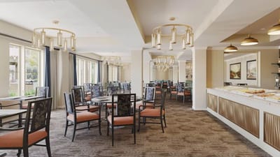 Bright dining area with tables and chairs