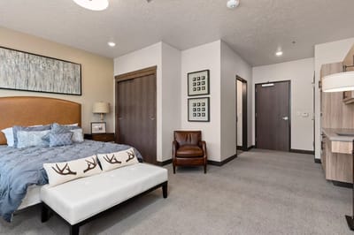 Cozy resident room with a bed and seating