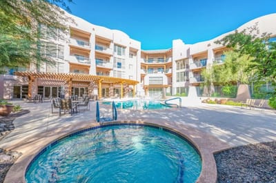 Swimming pool surrounded by the building exterior
