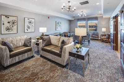 Cozy common area with comfortable seating and artwork
