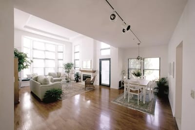 Bright, airy common area with seating and dining space