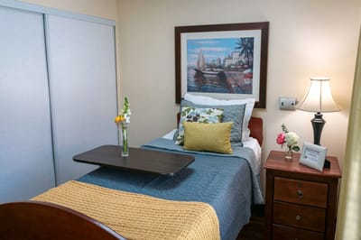 Cozy private room with bed and artwork