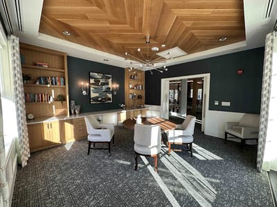 Bright common area with seating and bookshelves