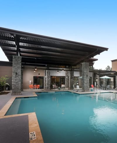 Outdoor pool area with lounge seating
