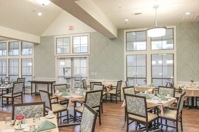 Dining room setup with tables and decorations