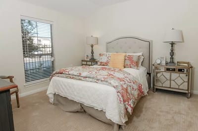 Cozy bedroom with floral bedding and natural light