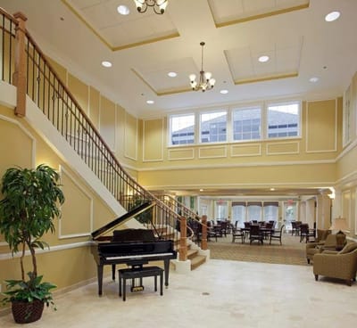 Interior view of a spacious lobby with a piano