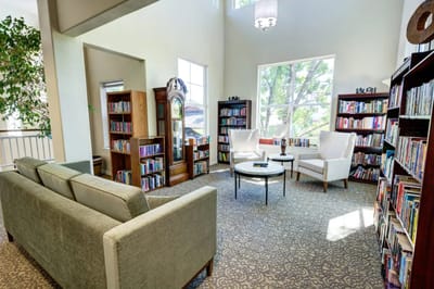 Bright common area with bookshelves and seating