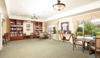 Common area with bookshelves and seating