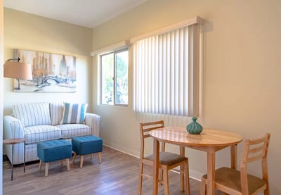 Cozy seating area in an assisted living facility room